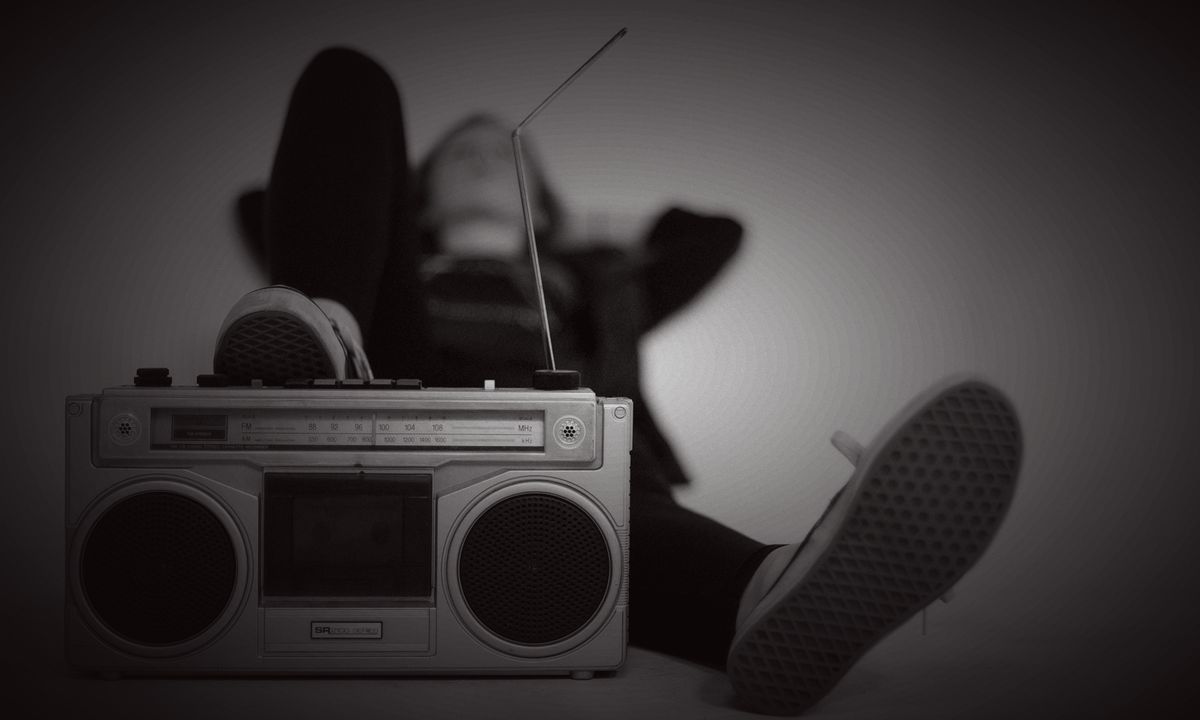 A person listening on headphones, shot from above