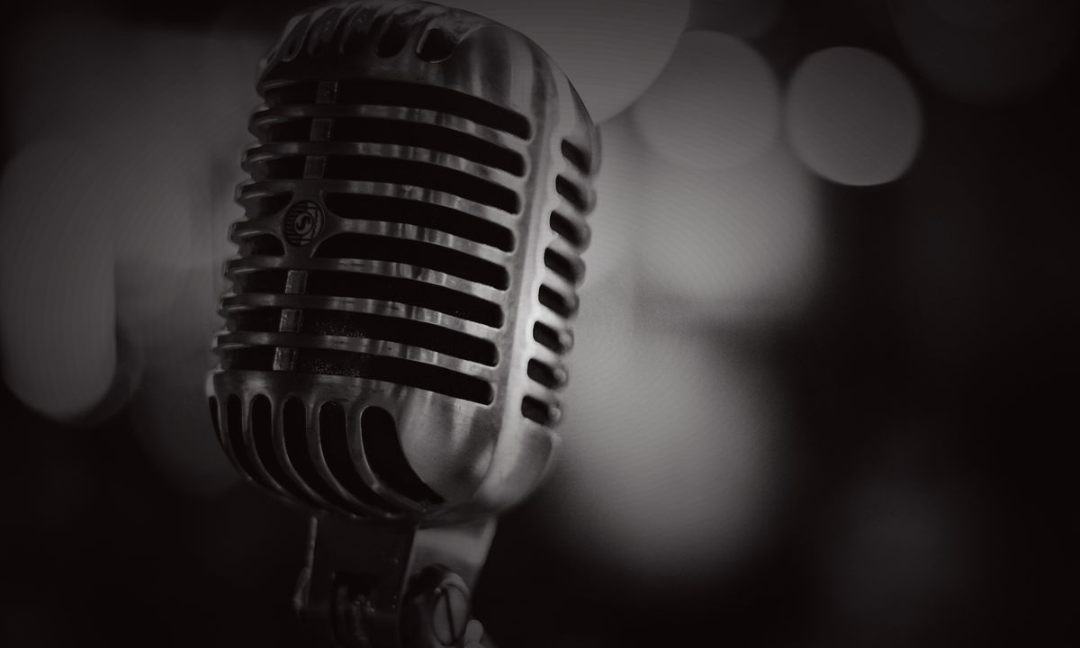 A vintage broadcast microphone in close focus